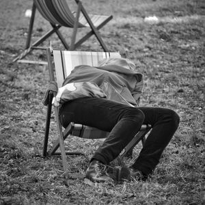 People sitting on grassy field