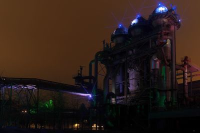 Low angle view of illuminated street light at night