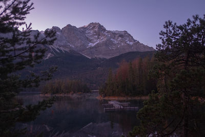 Scenic view of lake and mountains against sky