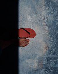 Close-up of human leg on flooring