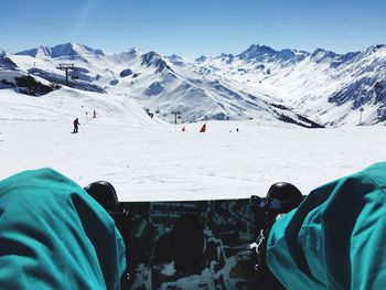 Tourists on snow covered mountain