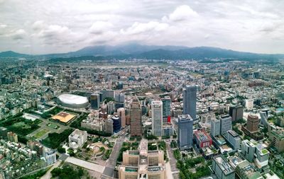 High angle view of city buildings against sky