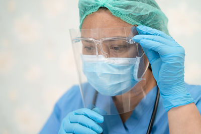 Close-up of doctor wearing face shield