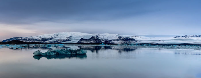 Scenic view of frozen lake against sky