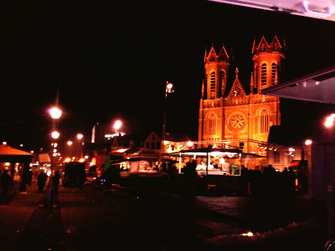 VIEW OF ILLUMINATED BUILDINGS AT NIGHT