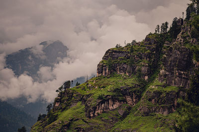 Low angle view of rock formations against sky