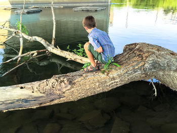 Boy jumping in water