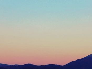 Scenic view of mountains at sunset