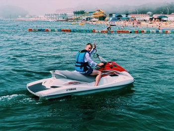 People on boat in sea