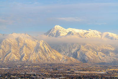 Scenic view of snowcapped mountains against sky