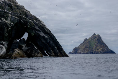 Scenic view of sea and rocks against sky