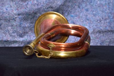 Close-up of bugle on table