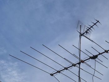 Low angle view of telephone pole against sky