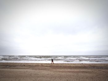 Man walking on beach