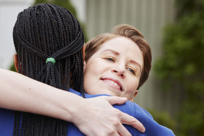 Female friends hugging each other