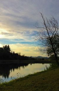 Scenic view of calm lake at sunset