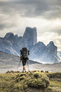 Rear view of person on land against sky