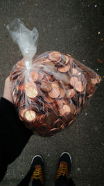Low section of man standing on tiled floor