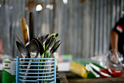 Close-up of kitchen utensils on table