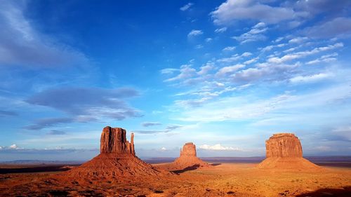 Rock formations in desert against sky