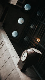 High angle view of illuminated clock on floor in building