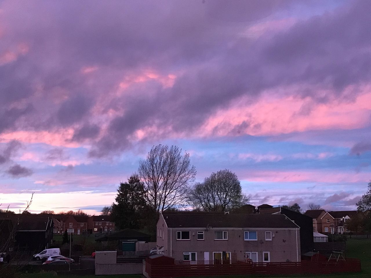 HOUSES AND TREES AGAINST SKY