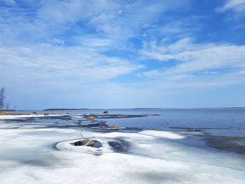 Scenic view of sea against sky during winter