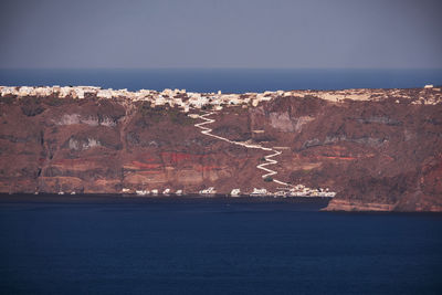 Panoramic aerial view of thirasia village in santorini island, greece - traditional white houses