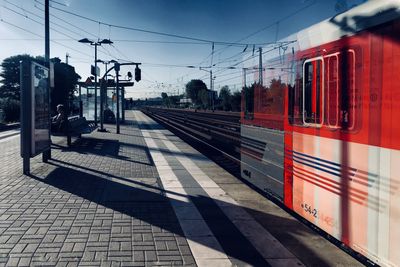 Train on railroad station platform against sky