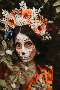 Portrait of woman with red flowers