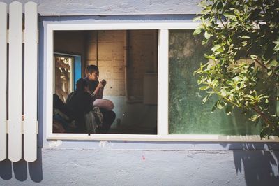 Young woman sitting outdoors