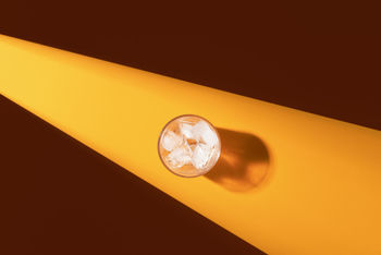 LOW ANGLE VIEW OF ILLUMINATED LIGHT ON CEILING