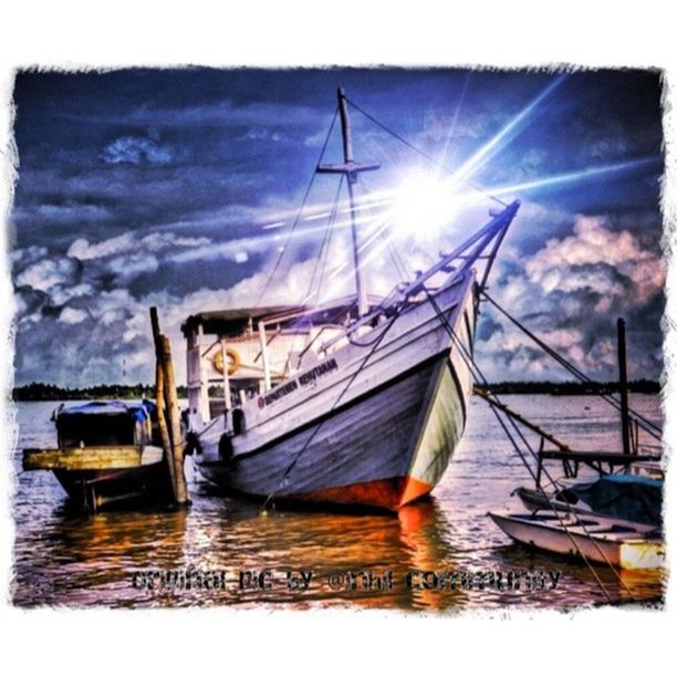 nautical vessel, water, moored, transfer print, boat, transportation, sky, mode of transport, auto post production filter, mast, sea, harbor, reflection, sailboat, waterfront, cloud - sky, lake, cloud, sun, pier