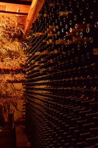 Low angle view of wine bottles on glass