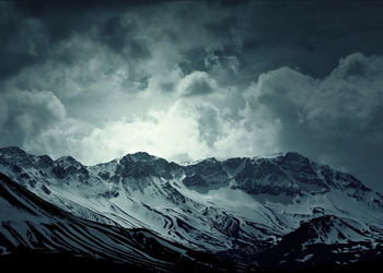 Scenic view of snow mountains against sky