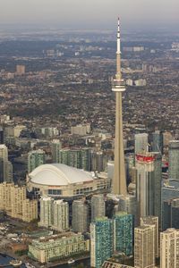 The cn tower and rogers centre during a sunny day