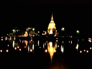 Reflection of illuminated buildings in water at night