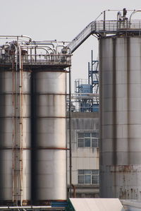 Low angle view of factory against sky