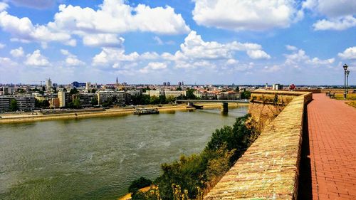 Panoramic view of river and buildings against sky