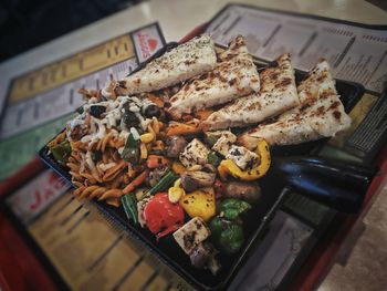 High angle view of meat on barbecue grill