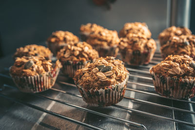 Close-up of muffins on rack