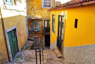 Alley amidst buildings in city