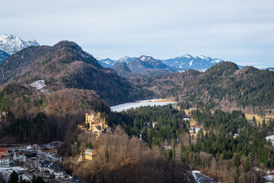 Scenic view of mountains and trees against sky