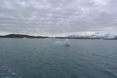 Scenic view of sea against sky during winter