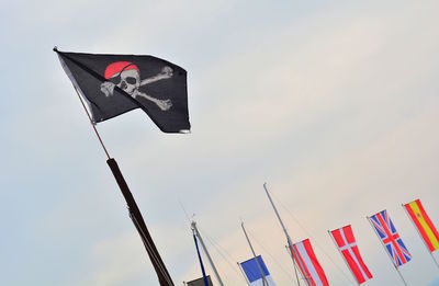 Low angle view of flag against sky