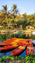 Boat moored at beach against sky