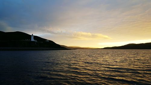 Scenic view of calm sea at sunset