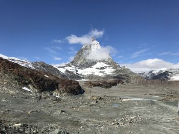 Scenic view of snowcapped mountains against sky