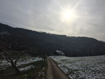 Scenic view of snow covered mountain against sky