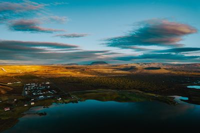 Scenic view of lake against sky during sunset